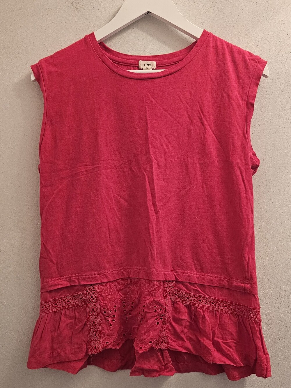Tiny Anthropologie sleeveless top features a bright pink color